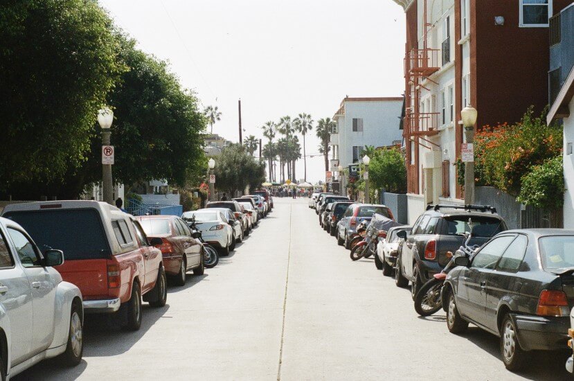 A street showing cars with fines