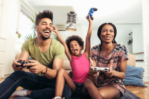 Family enjoying playing video games