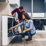 Couple buying kitchen appliances