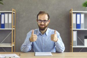 Man signing okay with his tax returns