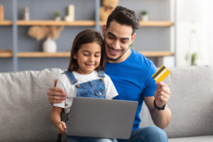 Father and Daughter using a giftcard