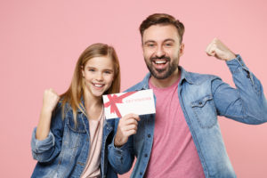 Daughter giving her father a giftcard