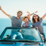 Happy family travelling on a budget