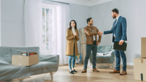 A couple buying a home with a real estate agent