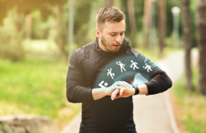 Professional runner using smartwatch to track his training