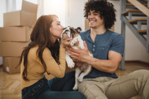A couple celebrating their pet dog got insurance