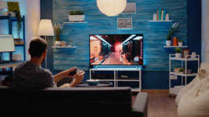 A boy gaming on a TV