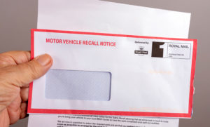 Official notification letter and envelope for a car recall