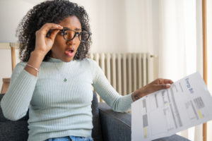 One shocked woman worried about home energy expenses