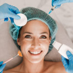 Photo of smiling woman getting cosmetic surgery