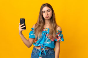 Young woman looking for a better mobile phone plan