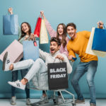 excited friends having fun shopping on Black Friday deals