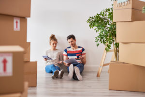 A couple comparing quotes from different movers