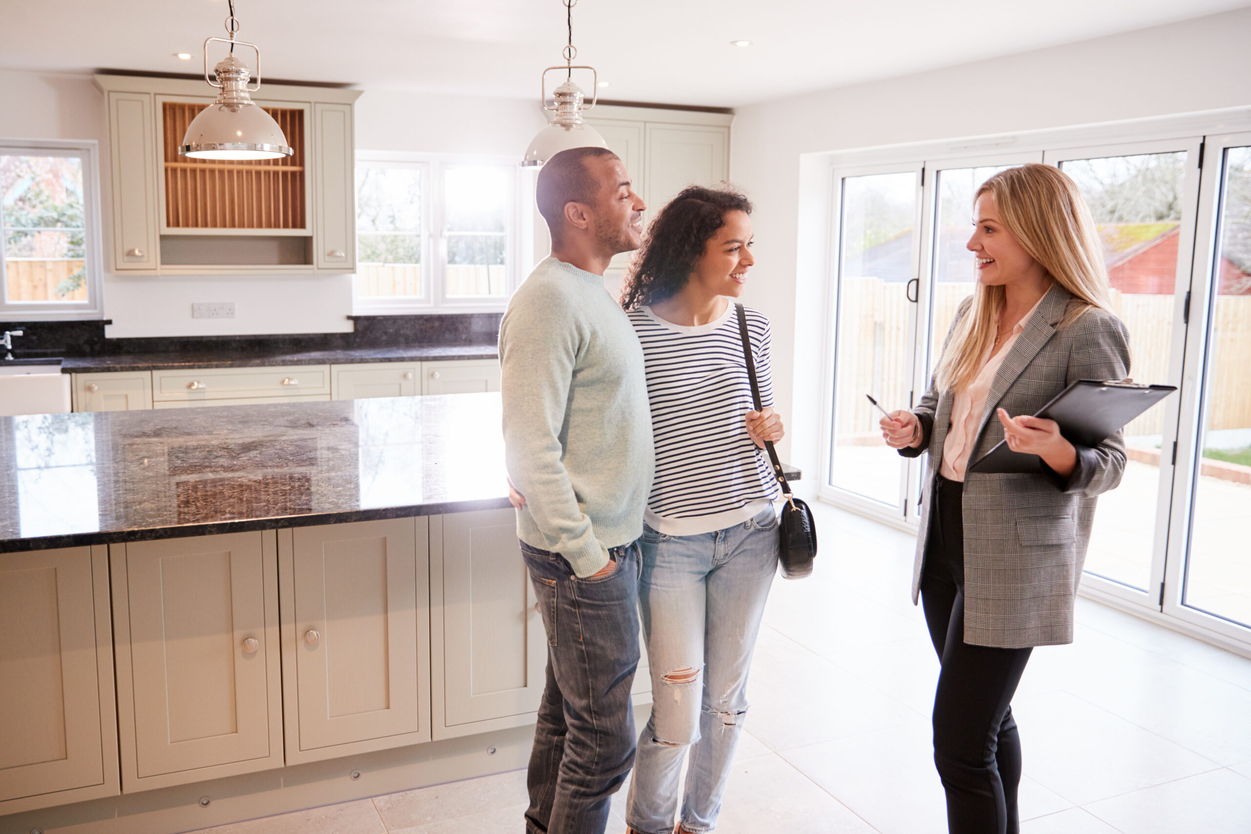 A mortgage broker helping a couple refinance their home loan