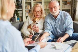 A couple getting help from a financial advisor to get out of debt