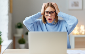 A woman shocked to learn the tech news about Optus data breach