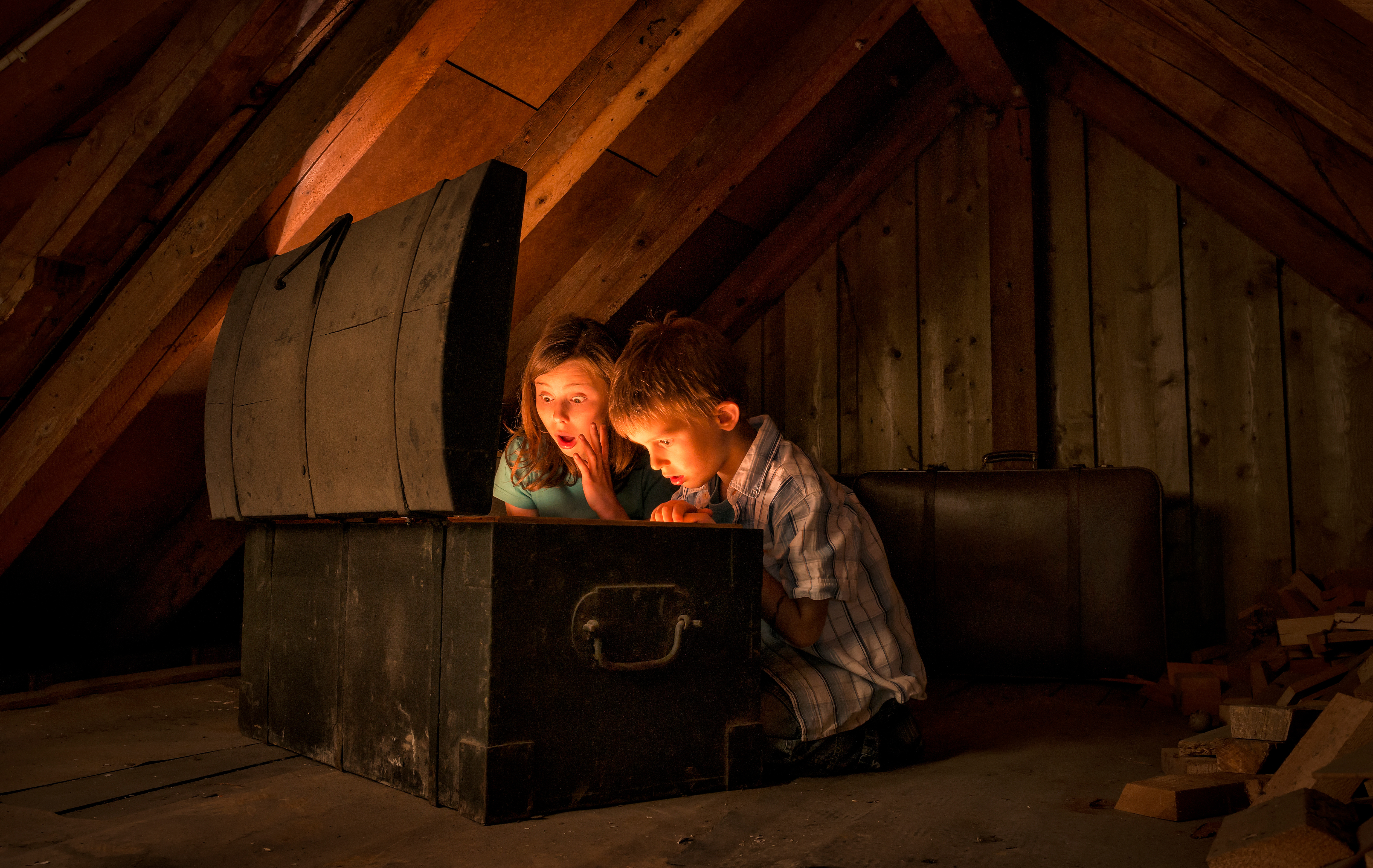 Kids finding hidden treasures of collectibles at home attic