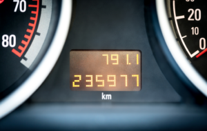 A car odometer showing mileage restrictions