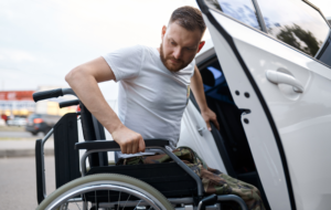 A man on a wheelchair entering a modified vehicle