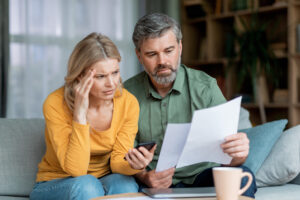 A stressed couple suffering financial hardship