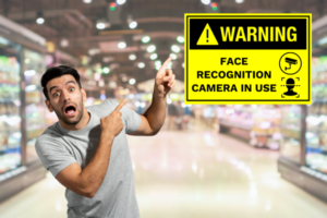 A man shocked to see a sinage of facial recognition in a retail store