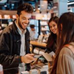 Man happy buying an extended warranty in tech store