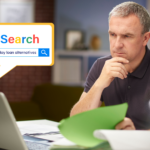 Man reviewing bills and searching for payday loan alternatives