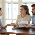 Frustrated young couple complaining about an insurance company