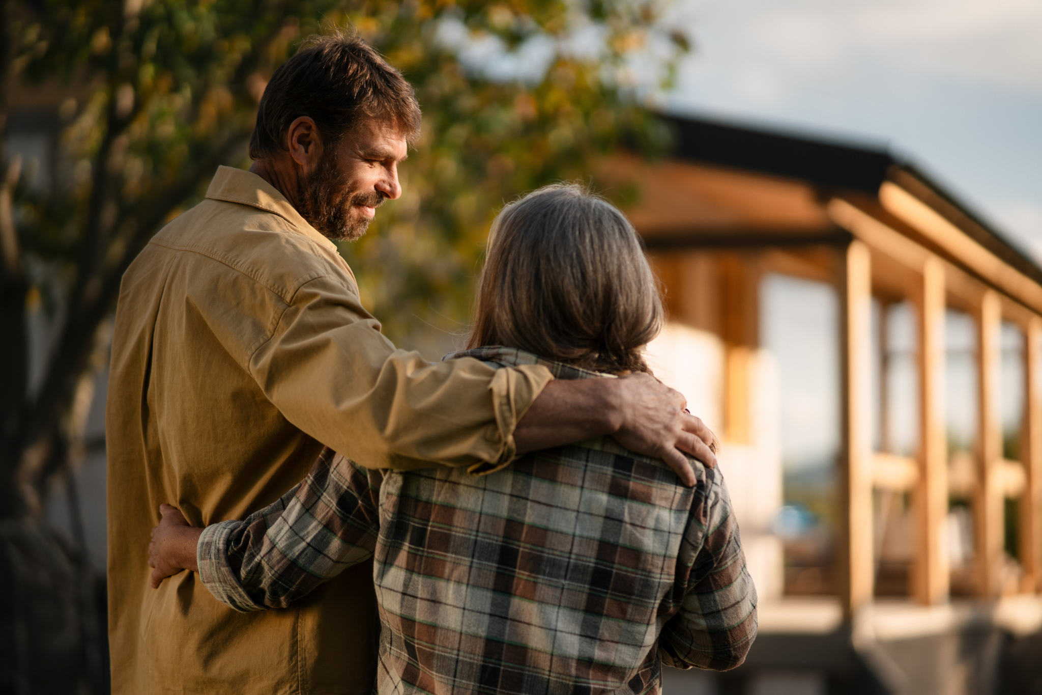 A couple staring at their unfinished home, left in limbo after their builder goes into liquidation