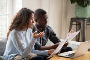 A couple lodging a complaint against their insurance company