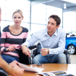 Anxious couple seeking help with their car insurance claim