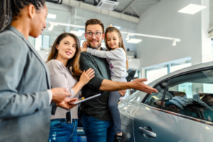 A family buying a used car and negotiating with a seller