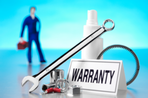 A warranty card and repair tools representing car warranties