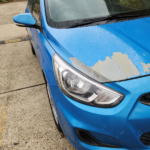 Blue Hyundai peeling paint on hood