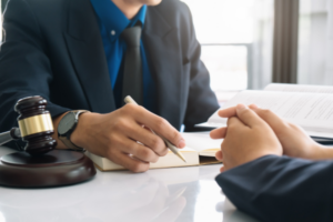 A plaintiff consulting a lawyer about a class action