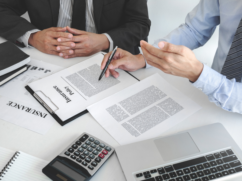 Person reviewing their insurance policy before making an AFCA complaint