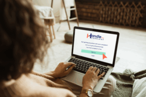 Woman using a laptop to lodge her Hyundai paint peeling complaint with Handle My Complaint
