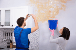 A man taking photo of the Typlex leaky pipes and its damages