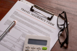 Close-up of a travel insurance claim form on a desk, highlighting coverage for flight cancellations and delays