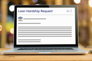 A laptop screen displaying an email requesting loan hardship assistance