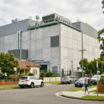 Large data centre surrounded by homes in a leafy Australian suburban neighbourhood